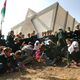 Palestinian children plant flowers outside the synagogue after the evacuation of Neve Dekalim.